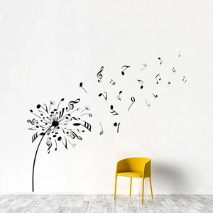 Modern black dandelion musical note wall decal displayed on a white minimalist living room wall