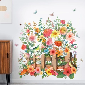 Garden wall decal with pink roses, butterflies, and wooden fence on a white wall