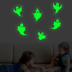 Luminous ghost wall stickers glowing green in kids room for Halloween decoration