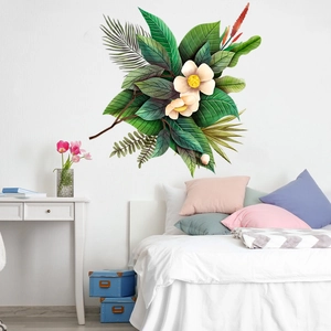 Bedroom wall decal showing tropical green leaves and white flowers in a modern interior