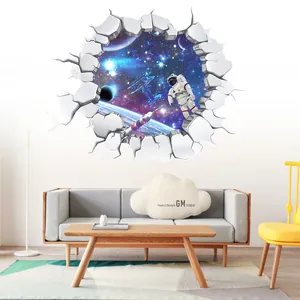 3D space wall decal showing astronaut and planets through a cracked wall in a modern living room