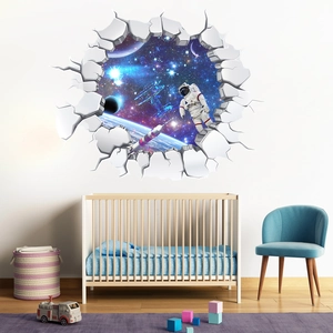Detailed view of 3D cracked wall space decal featuring an astronaut in a kids room