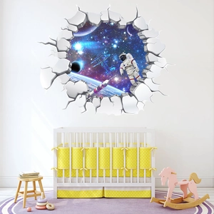 Close-up of 3D space wall sticker with astronaut and galaxy view in a kids' nursery
