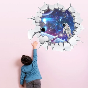 3D space wall decal showing an astronaut in the galaxy with a child touching the planets