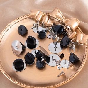 DIY lapel pin set with silver flat head pins and black rubber clutch backs on gold tray