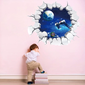 Child touching 3D outer space broken wall sticker with Earth and satellite