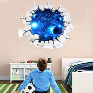 Child looking at a 3D wall sticker with galaxy nebula and broken wall effect in a bedroom