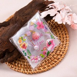 Pink stone and pearl beaded bracelet in floral Thank You gift packaging bag