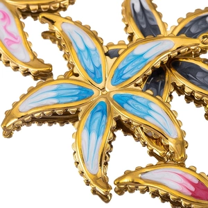 Starfish pendant with gold plating and colorful marble enamel texture on white background