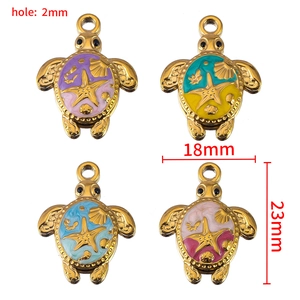 Set of four stainless steel sea turtle pendants with colorful enamel ocean designs