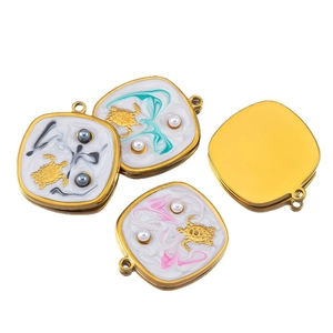 Square stainless steel sea turtle charms with white enamel and inlaid pearl details