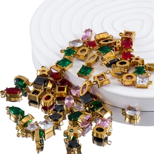 Colgantes vintage de acero bañados en oro 18K con circonitas de colores en varias formas