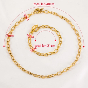 Golden stainless steel necklace and bracelet set with OT toggle clasp and twist link design