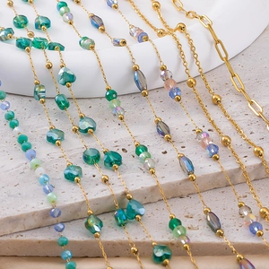 Gold stainless steel chains with colorful teal and blue crystal beads in various shapes
