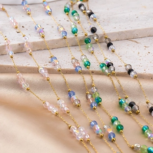 Golden stainless steel chain necklace with emerald green and multicolor crystal beads