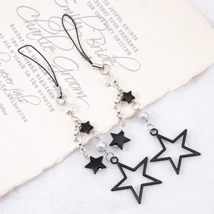 Star beaded keychain with black hollow stars and silver charms on elegant cream card