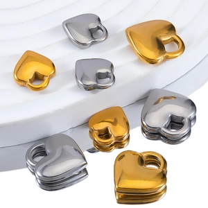 Polished stainless steel heart-shaped pendants in gold and silver for DIY jewelry