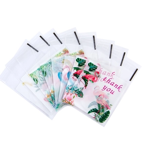 Transparent self-adhesive packaging bags with flamingo and tropical leaf patterns