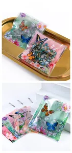 Close-up of butterfly and floral print transparent self-adhesive gift packaging bags