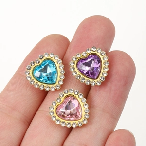 Double-layered crystal heart rhinestones in blue, purple, and pink with gold metal edges