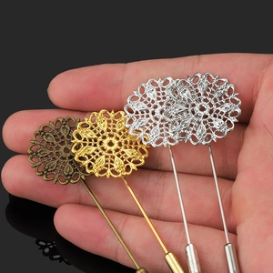 Hollow peacock feather filigree brooches in gold, silver, and bronze finishes