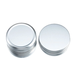 Stack of 40ml silver round aluminum metal tins with screw lid and non-slip texture