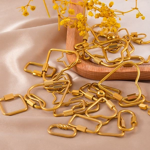 Golden stainless steel decorative clasps in heart and star shapes on beige silk fabric