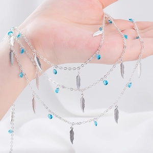 Elegant silver bohemian multilayer chain with feather pendants and blue beads