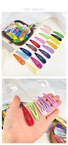Detail of colorful water drop metal BB clips with a smooth matte painted finish