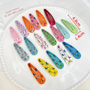 17-piece colorful metal BB clips set with cute animal and floral patterns in a dish