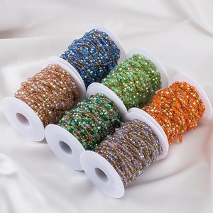 Detail of faceted glass bead chains on golden wire for DIY jewelry making accessories