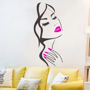 Detail of creative vinyl wall decal featuring a woman profile with pink lips and nails