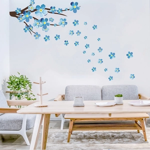 Blue plum blossoms wall sticker detail showing branches and flowers on a living room wall