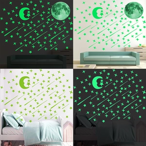 Luminous wall stickers set featuring moon, stars, and meteors for bedroom decor