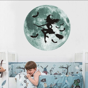 Luminous Halloween wall decal featuring a green moon with a witch silhouette and black bats