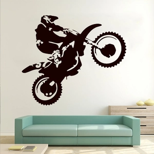 Black vinyl motorcycle wall decal featuring a stunt rider silhouette for living room decor