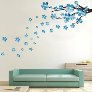 Detail showing blue plum blossom wall stickers with brown branches in a modern living room