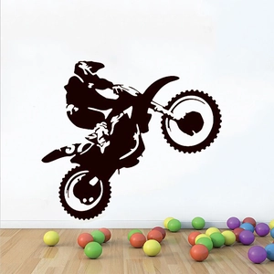 Detail showing a black motocross silhouette wall sticker above decorative colorful balls