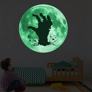 Luminous Halloween wall sticker showing a glowing moon with a zombie hand silhouette in the dark