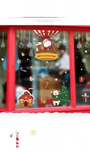 Detailed view of Christmas window stickers featuring Santa, snowman and reindeer motifs
