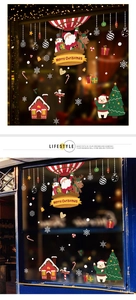 Detail of Christmas window stickers featuring Santa, reindeer, and snowmen designs