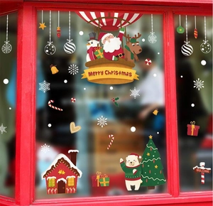 Christmas wall stickers featuring Santa in a hot air balloon with snowmen and reindeer
