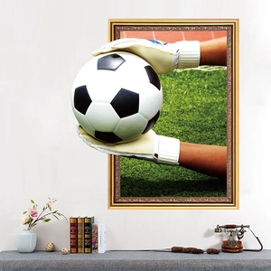 Detail of 3D football wall sticker featuring a goalkeeper catching a ball in a home setting