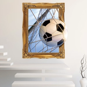 3D wall sticker showing a soccer ball breaking through a golden frame on a living room wall