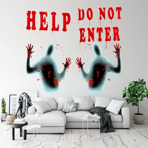 Detailed view of Halloween wall decals with glowing ghost figures and bloody handprints
