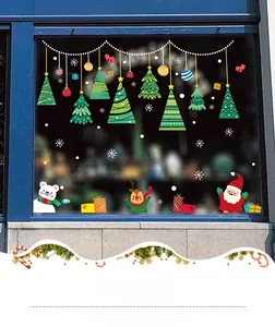 Detail view of festive Christmas window stickers featuring colorful Santa and Reindeer art
