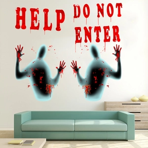 Macro detail of Halloween wall stickers with bloody handprints and scary HELP text