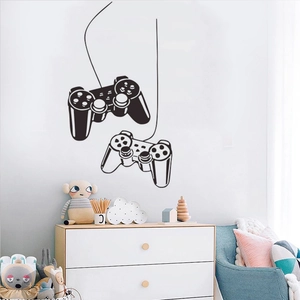 Creative vinyl wall decal of a game controller in a cozy children room setting