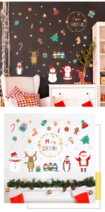 Christmas wall decal set with Santa and snowman stickers on black shop window background