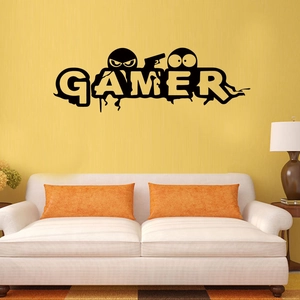 Detail of gamer wall decal featuring letters and ninja silhouettes on a yellow wall